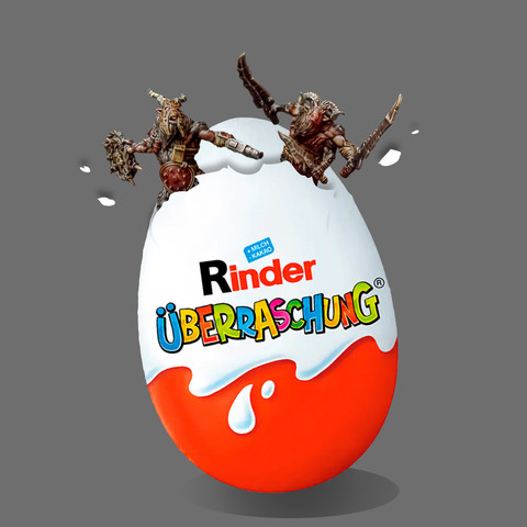 Two Beastmen miniatures bursting out of a Kinder Surprise Egg with 