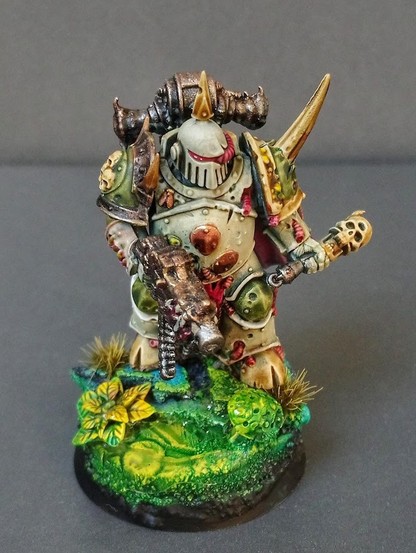 Fully painted miniature of a Plague Marine. 